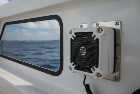 A VHF speaker mounted on a boat cabin wall.
